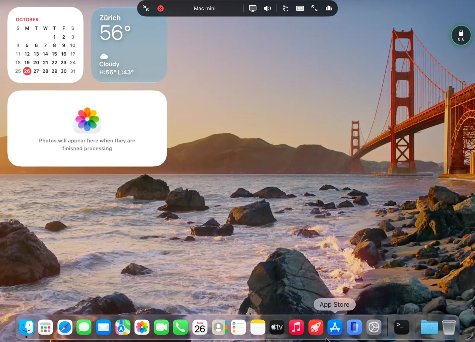 A Mac's desktop on an iPad, with Punte's controls bar open at the top and the connection ball at the right edge