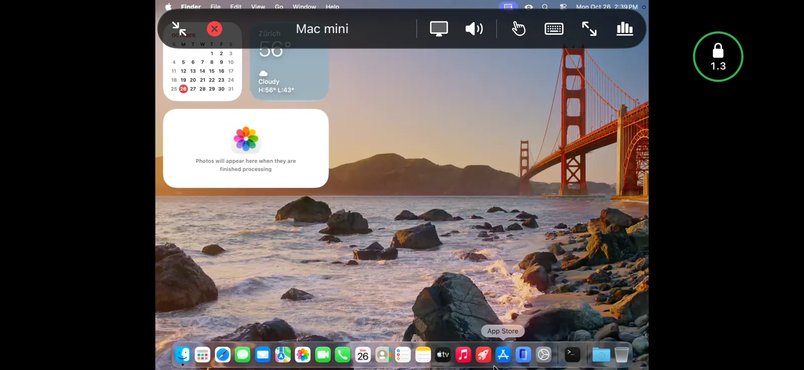 A Mac's desktop on an iPhone in landscape, with the controls bar open and the connection ball at the side